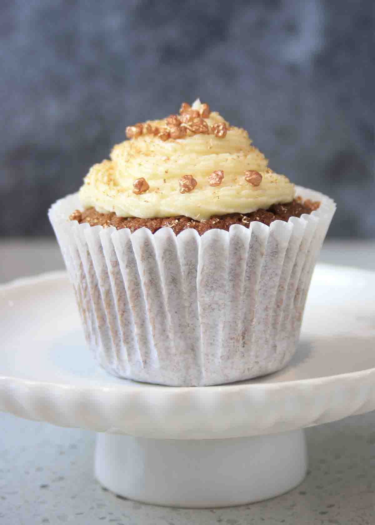 close up picture of muffin with buttercream.