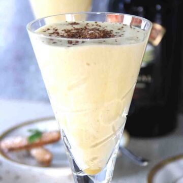 close up of a glass filled with sabayon or zabaglione.