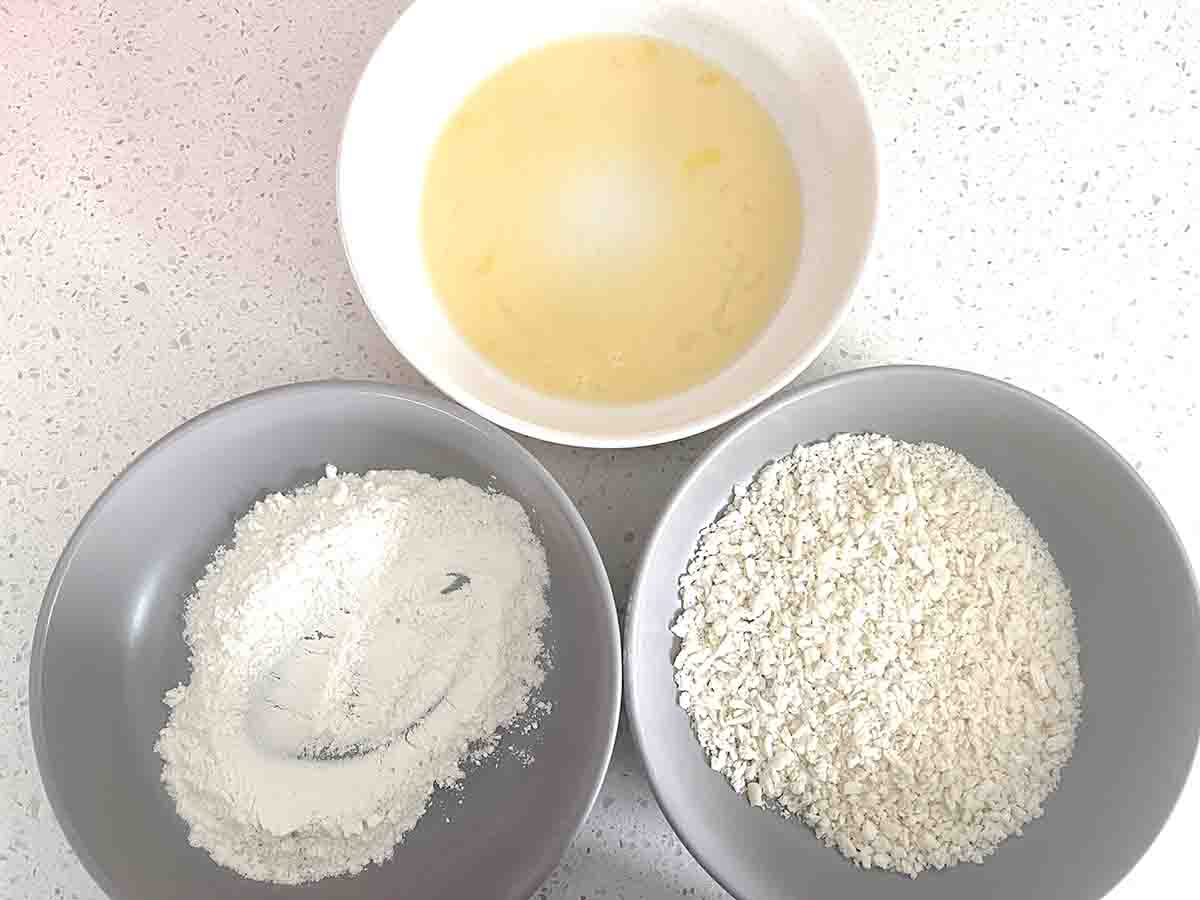 bowls of egg, breadcrumbs and flour.