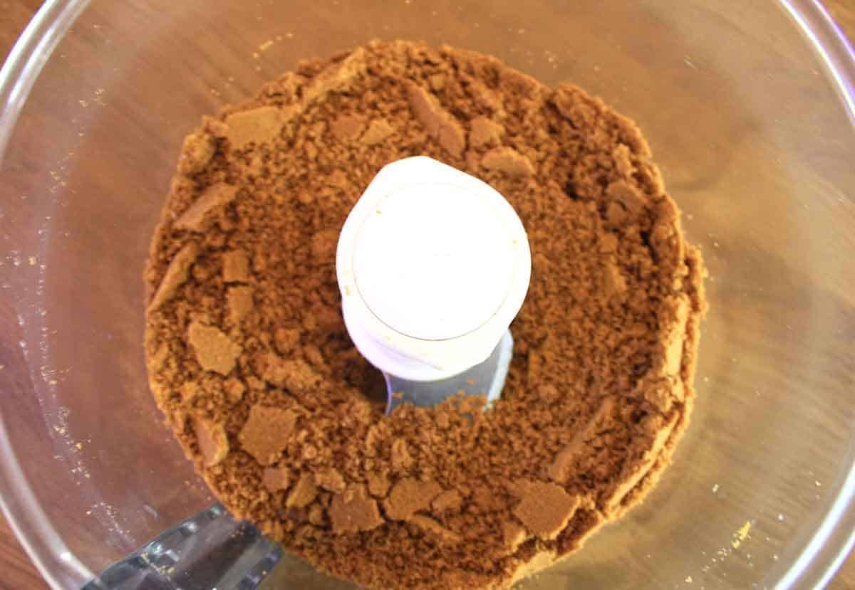 biscoff or lotus biscuits crushed in a food processor bowl.