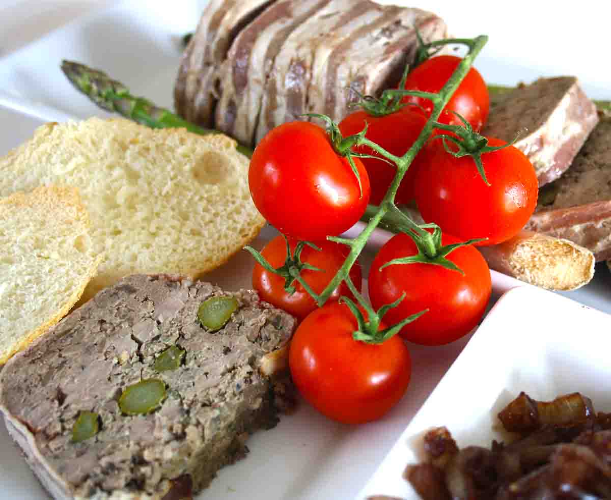 slices of duck terrine with tomatoes and onion chutney.