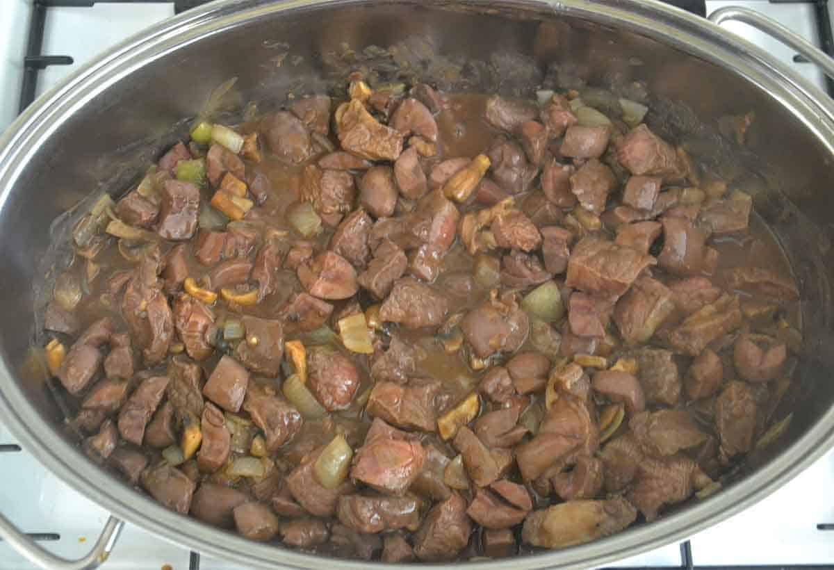 steak mix in stock in a large casserole dish.