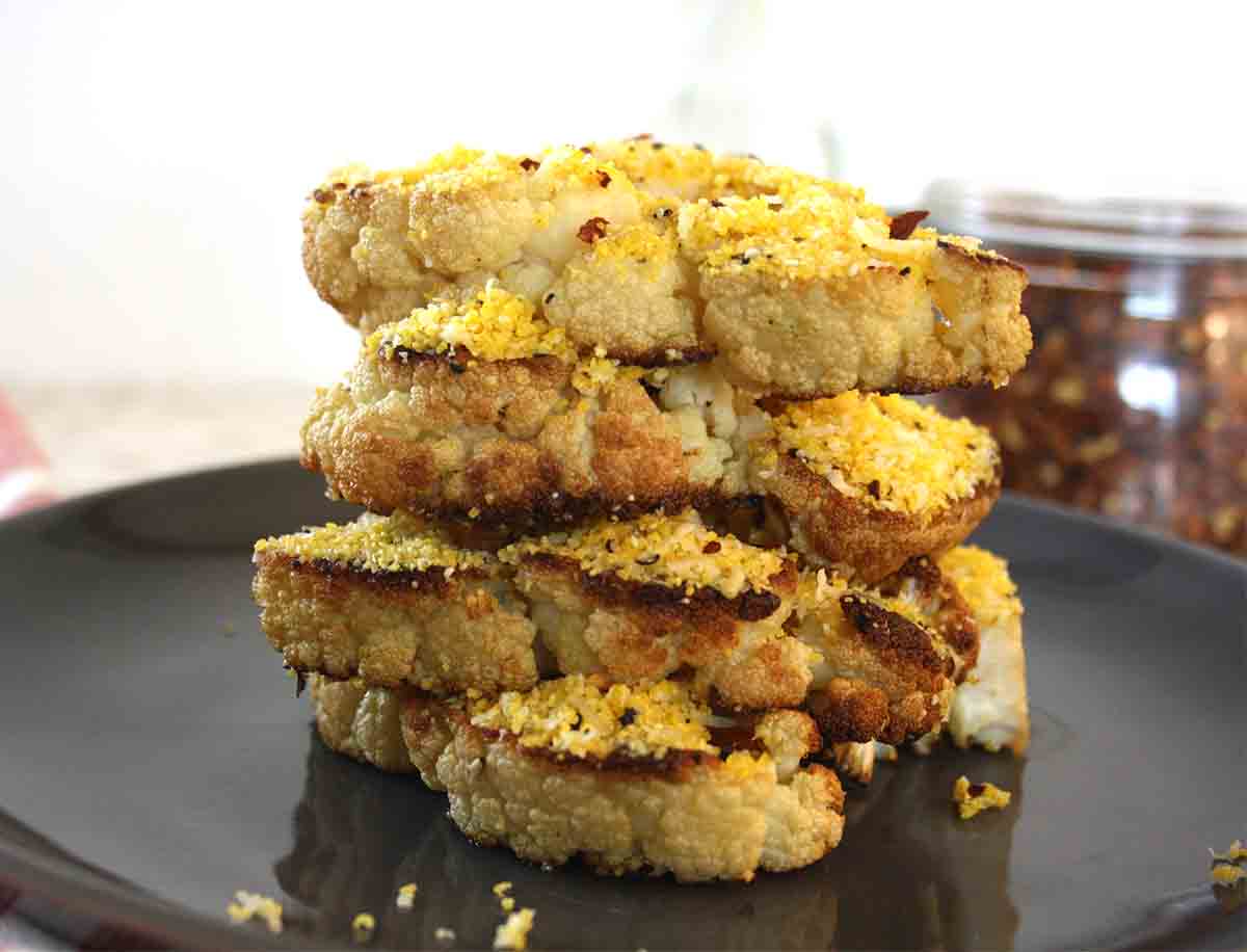 parmesan cauliflower steaks stacked up.