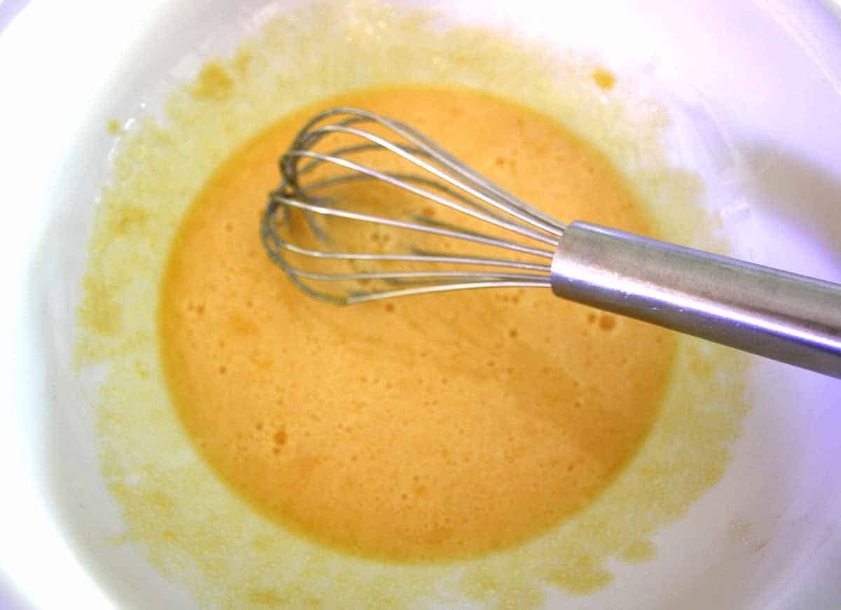 whisked egg yolks in a bowl.