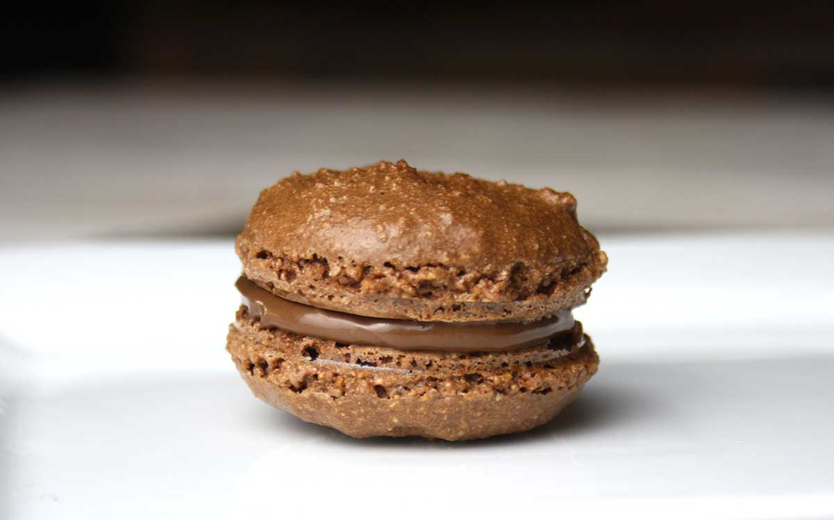 close up of a Nutella macaron.