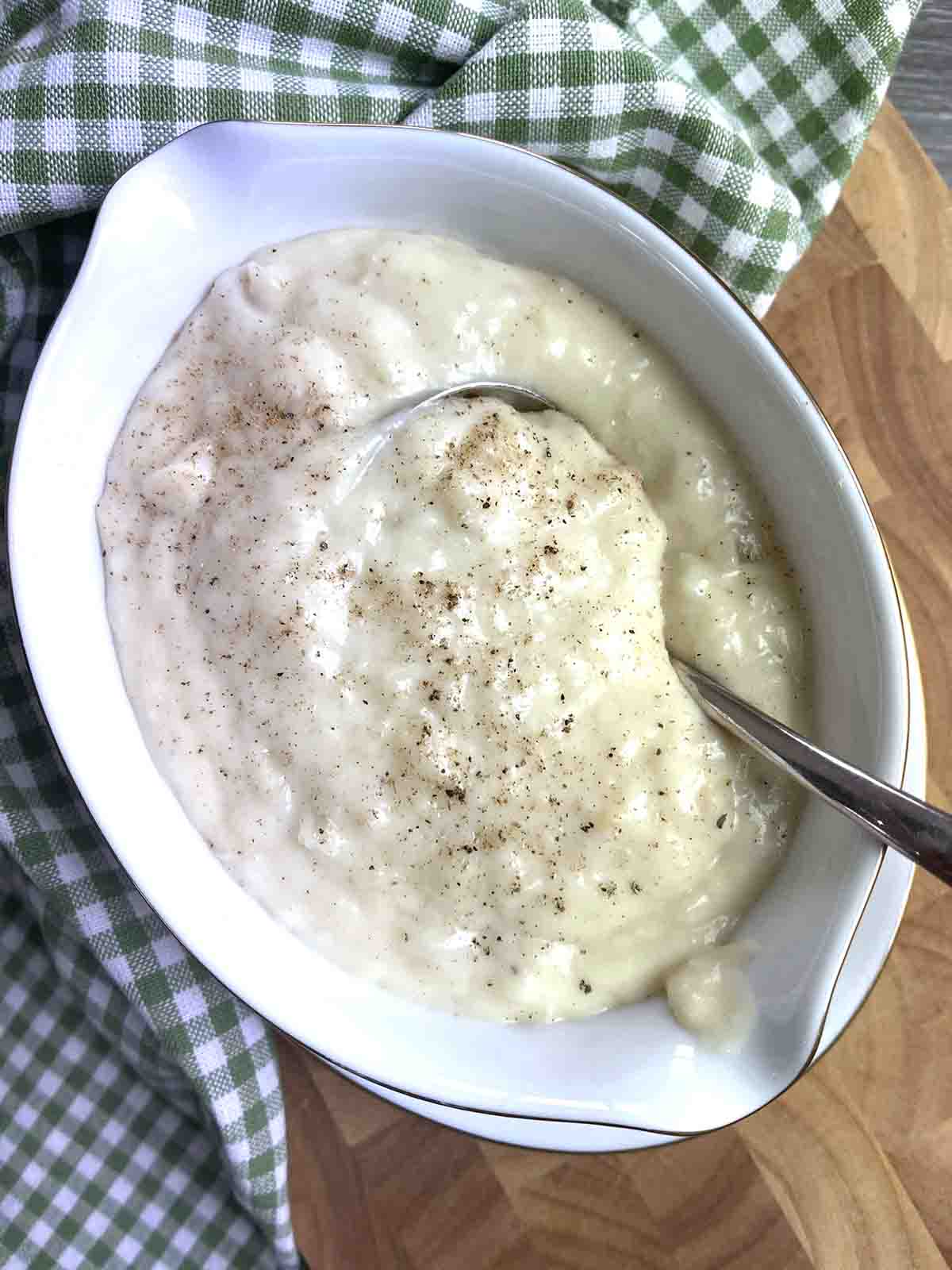 french white onion sauce soubise in a sauceboat.