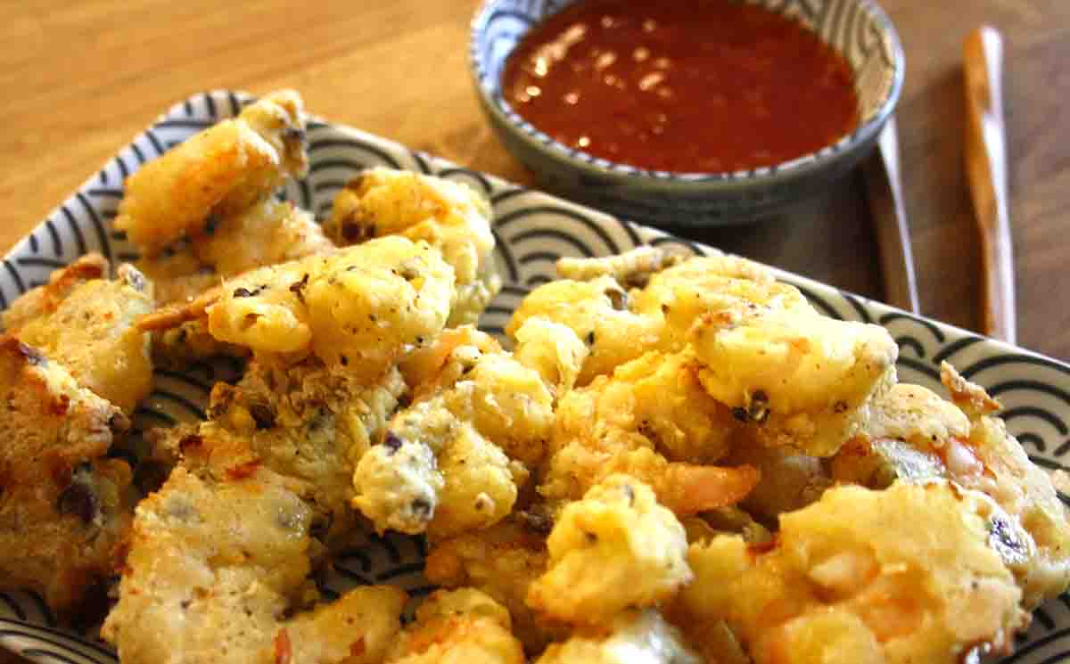 salt and pepper prawns cooked on a plate.