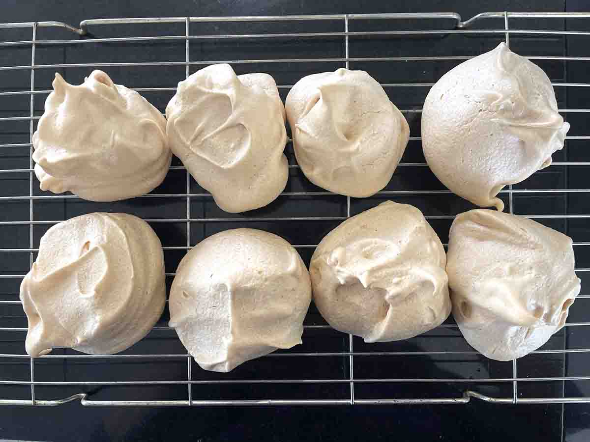 cooked meringue cooling on a rack.