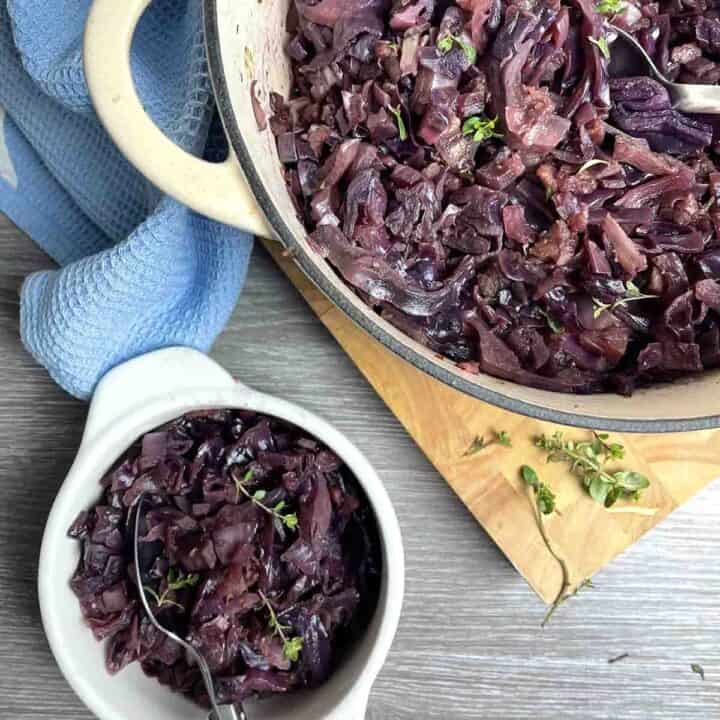braised red cabbage with apple in a pot.