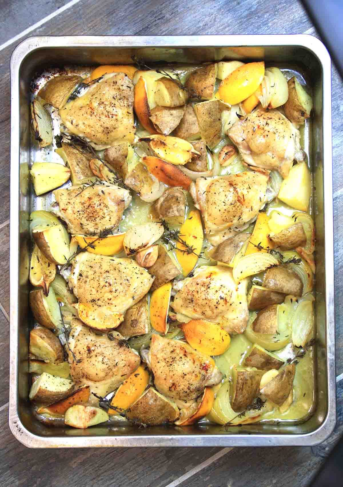 lemon garlic chicken bake in a roasting pan.