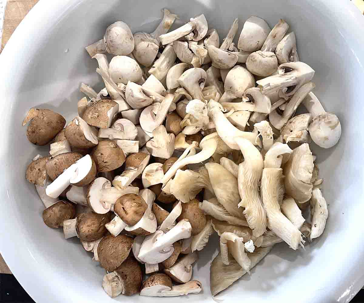 mixed cut mushrooms in abowl.