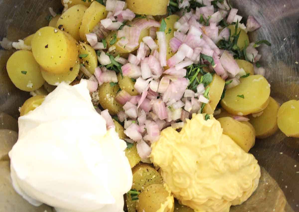 cooked potatoes with mayonnaise, creme fraiche, chopped tarragon and shallots added.