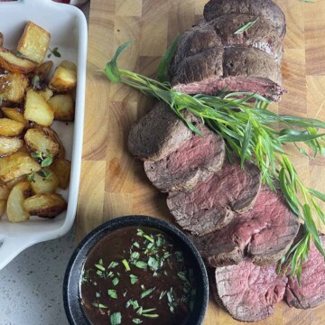 how to cook chateaubriand with porcini sauce in a pot and the beef sliced on a board.o