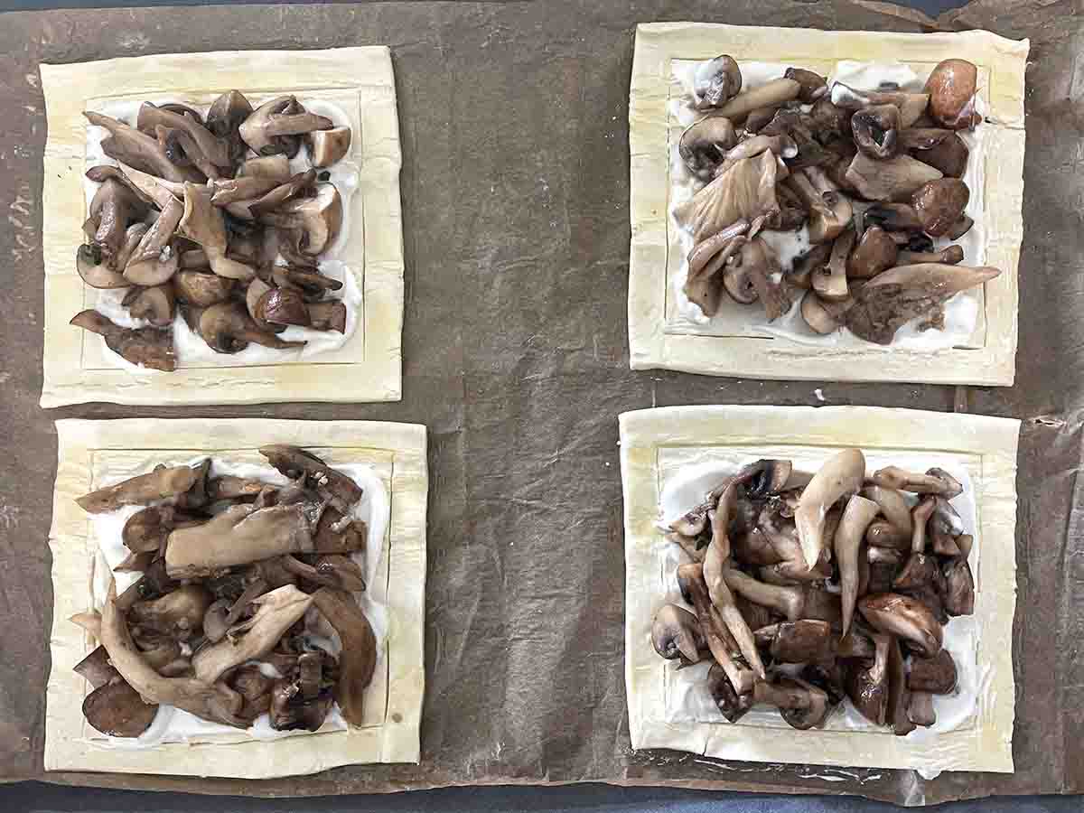 cooked mushrooms on the puff pastry ready for baking. 