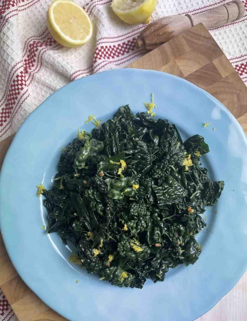 black cabbage cooked on a plate.