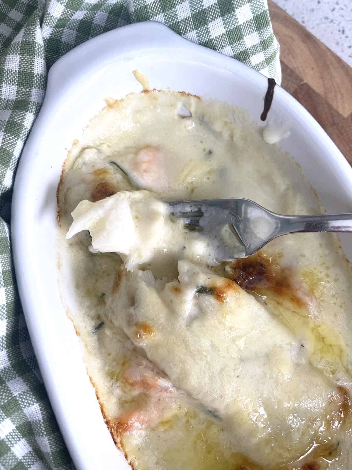 cooked fish in cheese sauce.