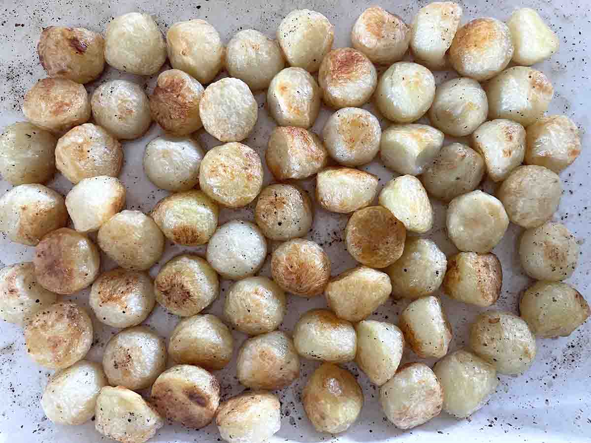 cooked potatoes in the roasting dish.