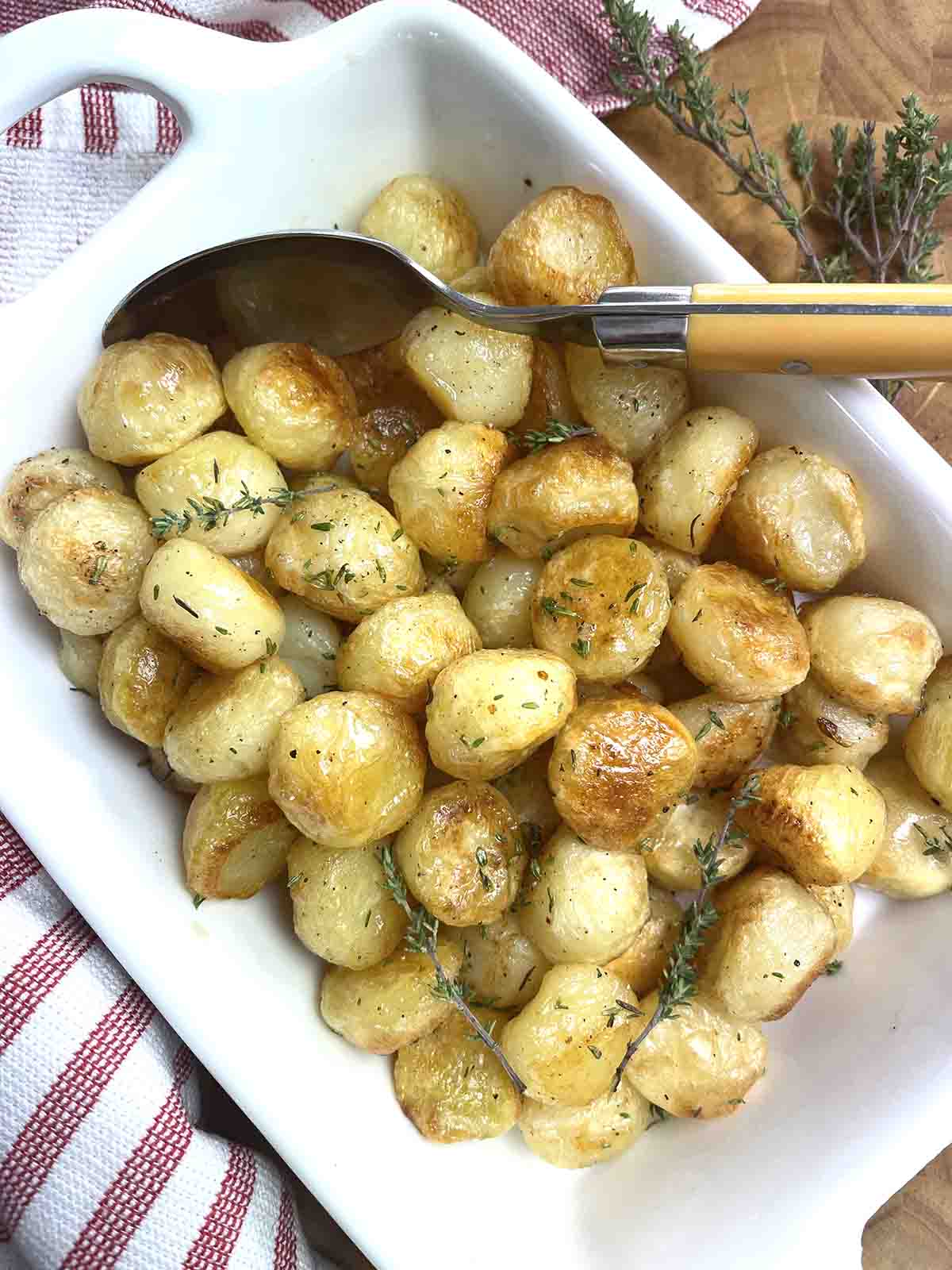 noisette potatoes in a serving dish.