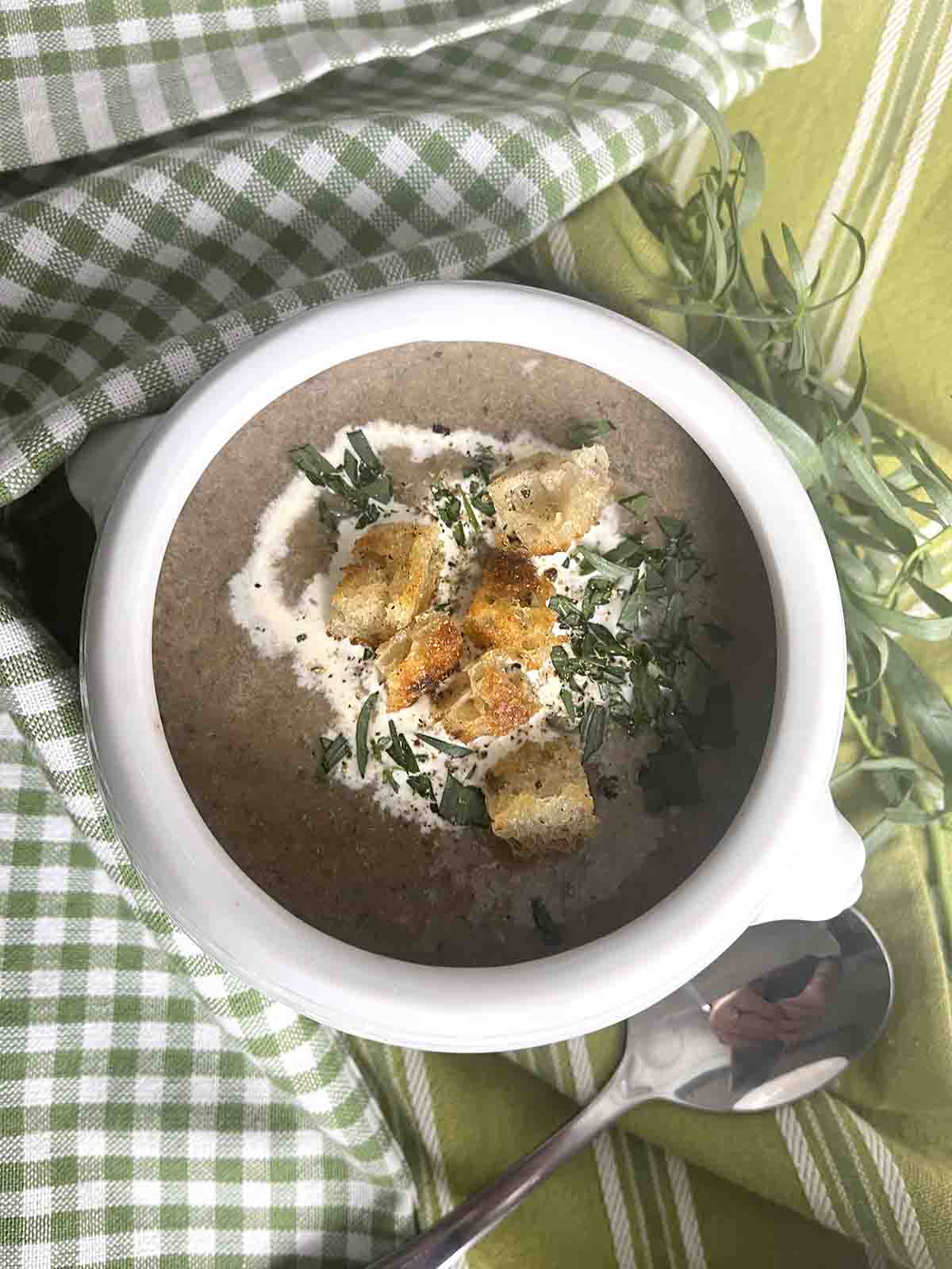 gluten free mushroom soup without cream in a bowl with croutons on top.