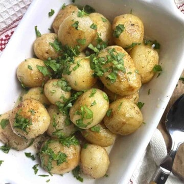 chateau potatoes in a white rectangular dish.