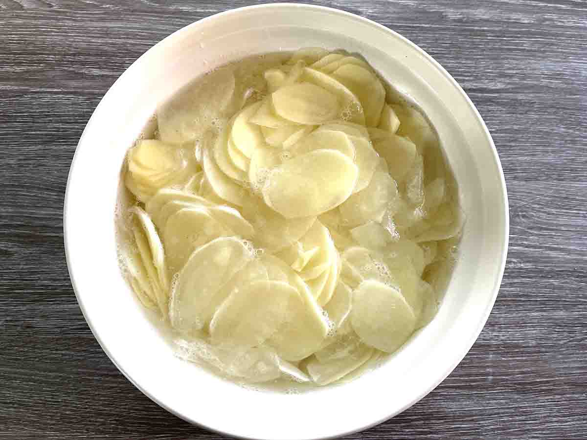 sliced potatoes in a bowl.