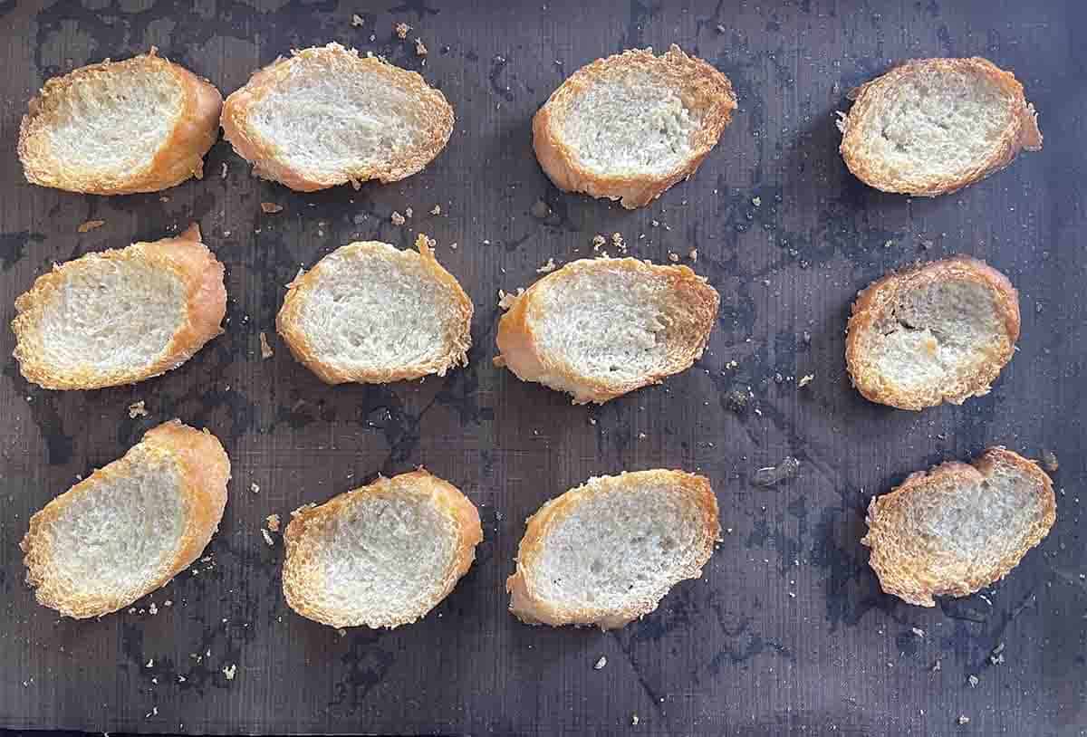 baked crostini on a tray.