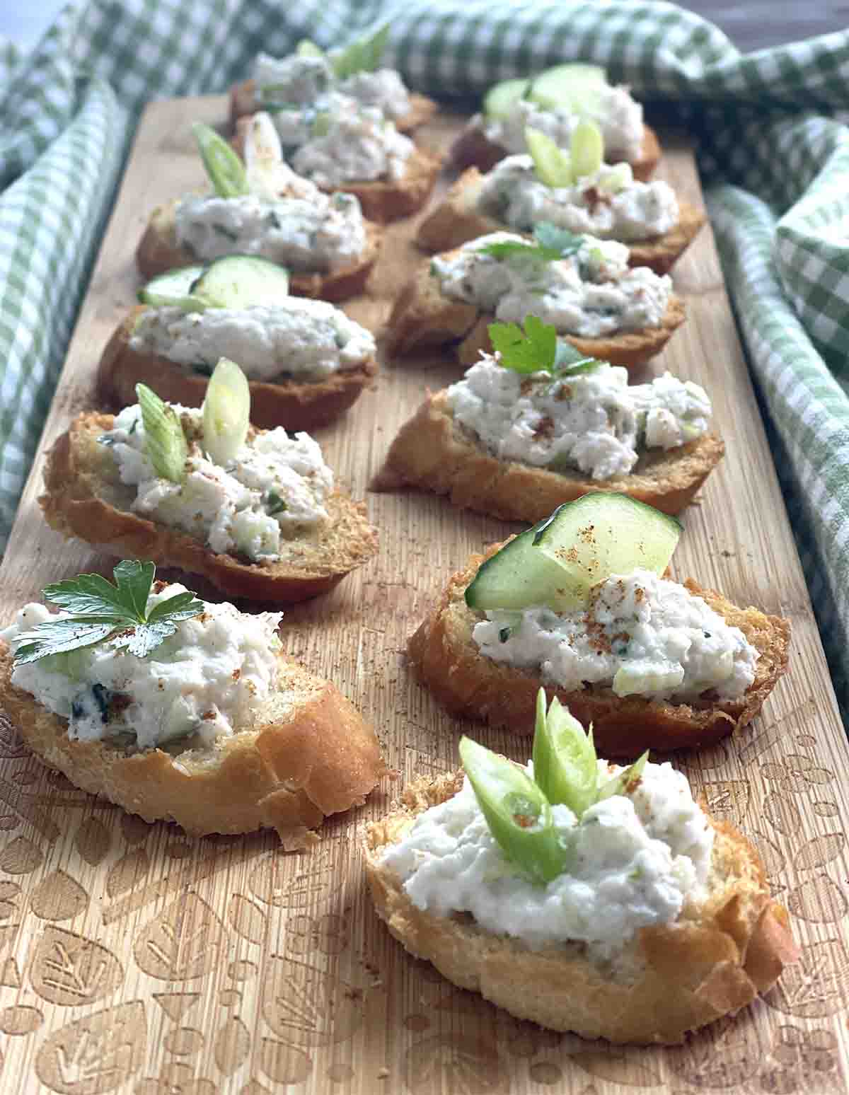 crab Canapés on a board.