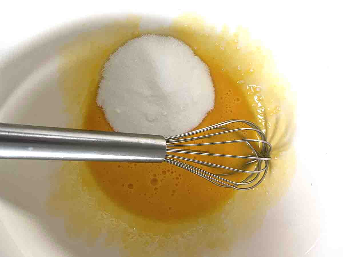 egg yolks and sugar in a bowl.