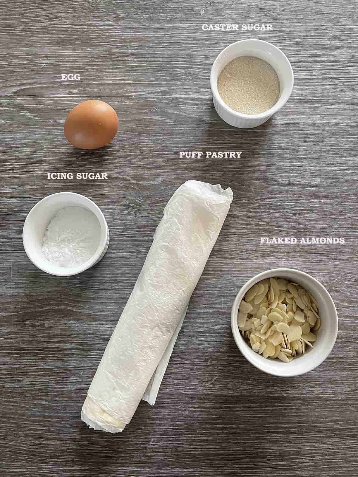 ingredients including puff pastry, egg, sugar and almonds.