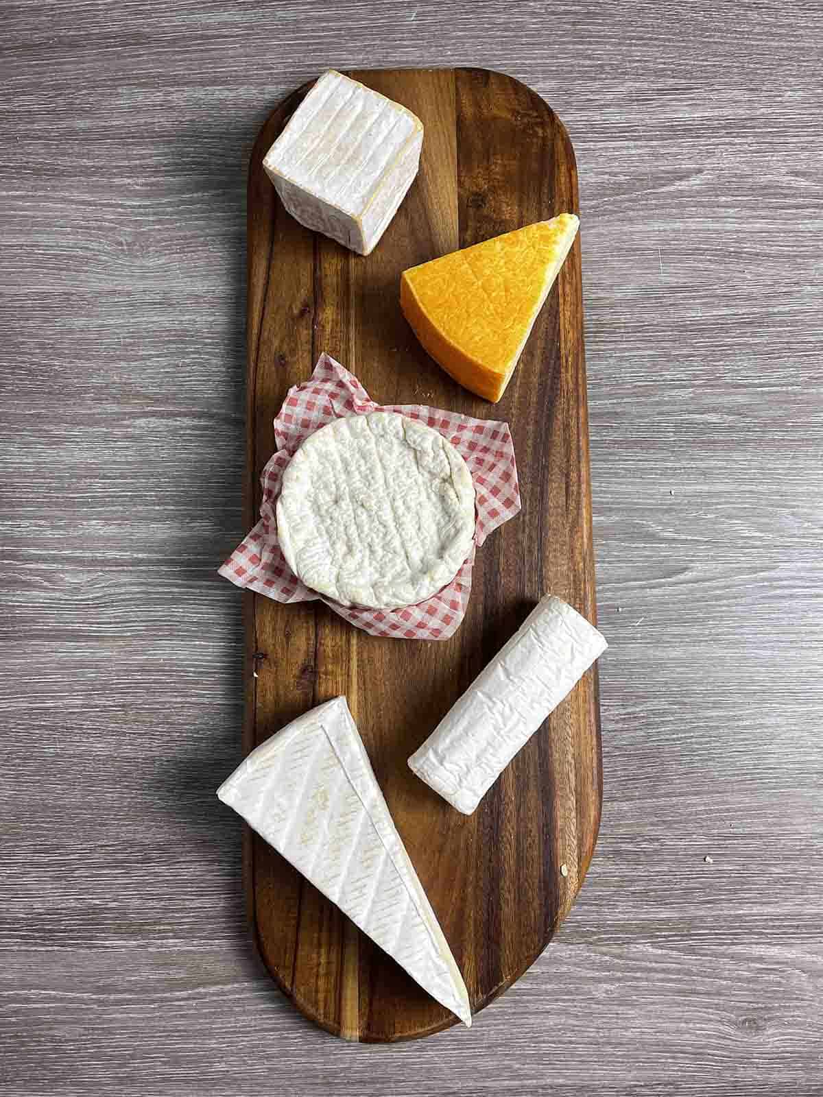 French cheeses on a board.