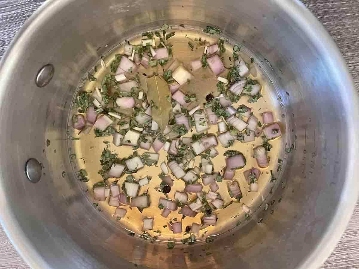 shallots, tarragon and vinegar in a saucepan.