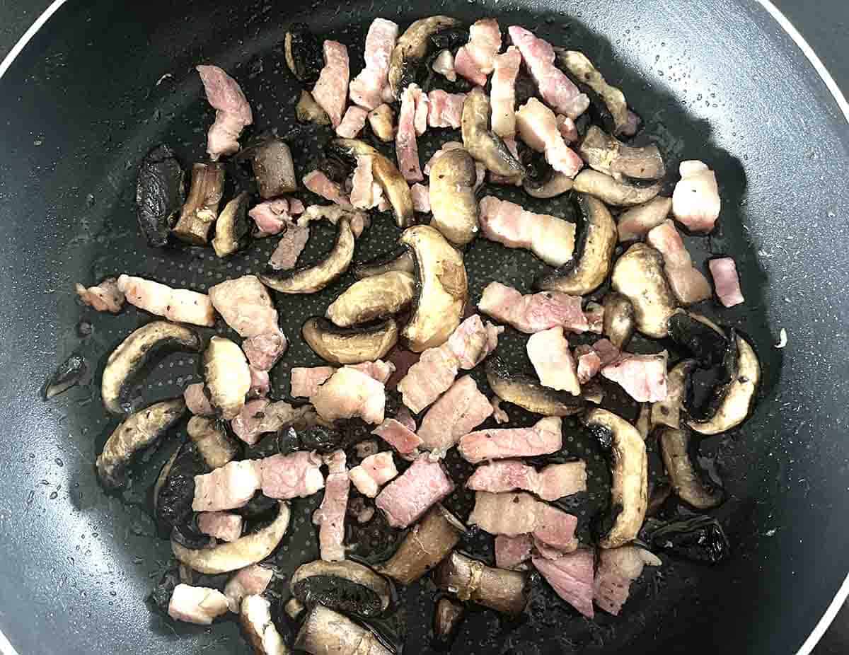 bacon and mushrooms in a pan.