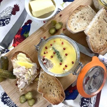 Chicken rillettes in a pot with bread to the side.