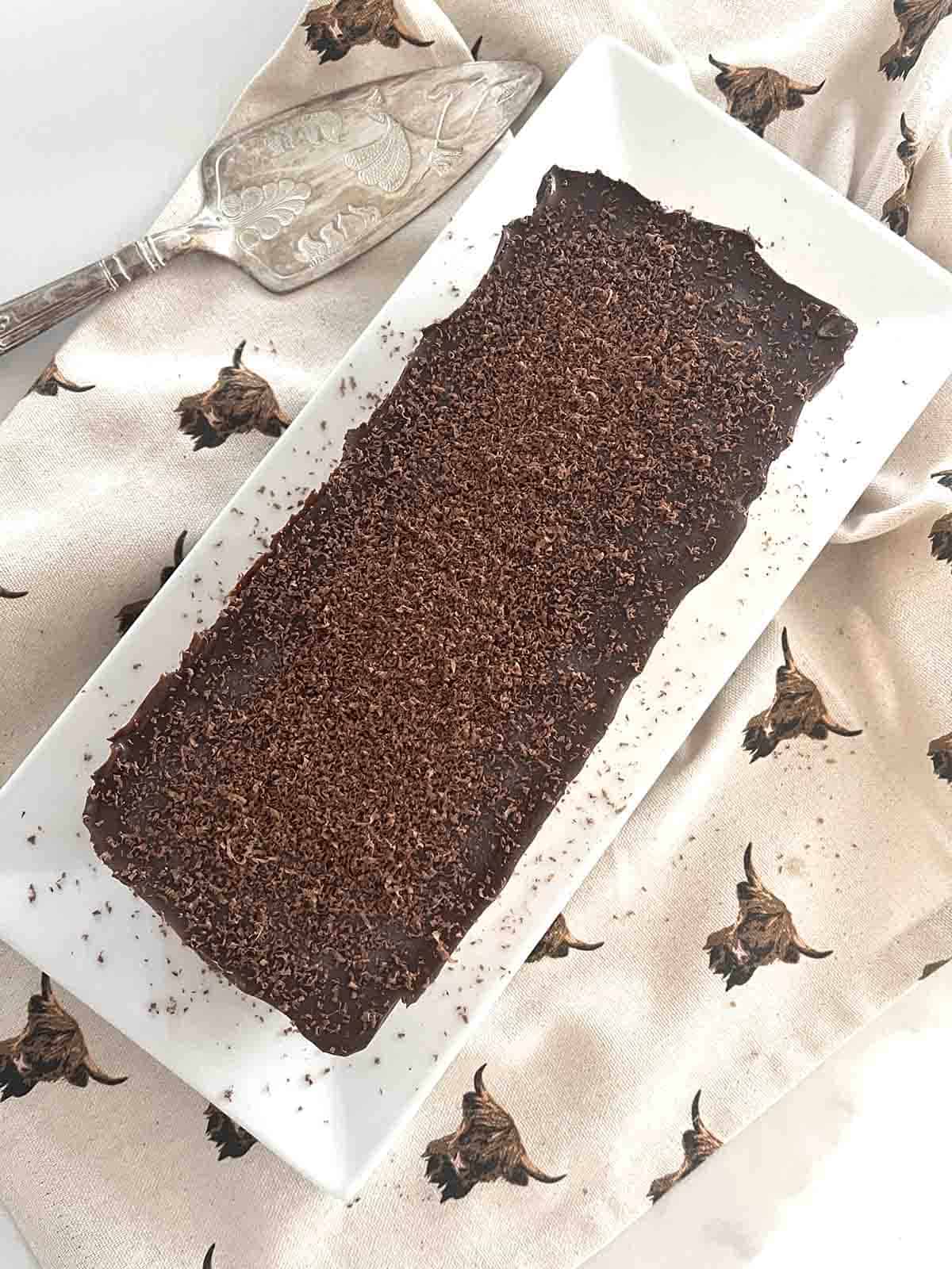 chocolate caramel ice cream parfait on a plate.