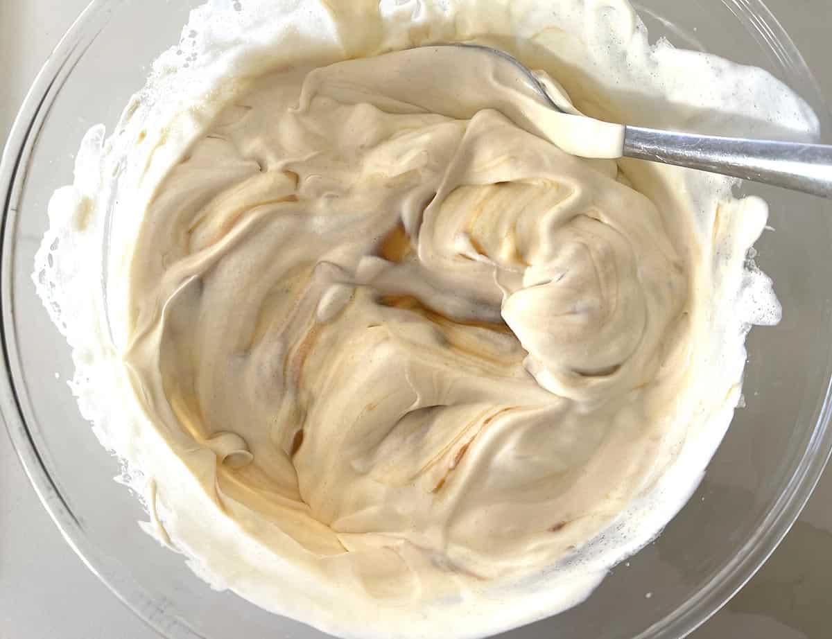 cream and caramel added to egg whites.