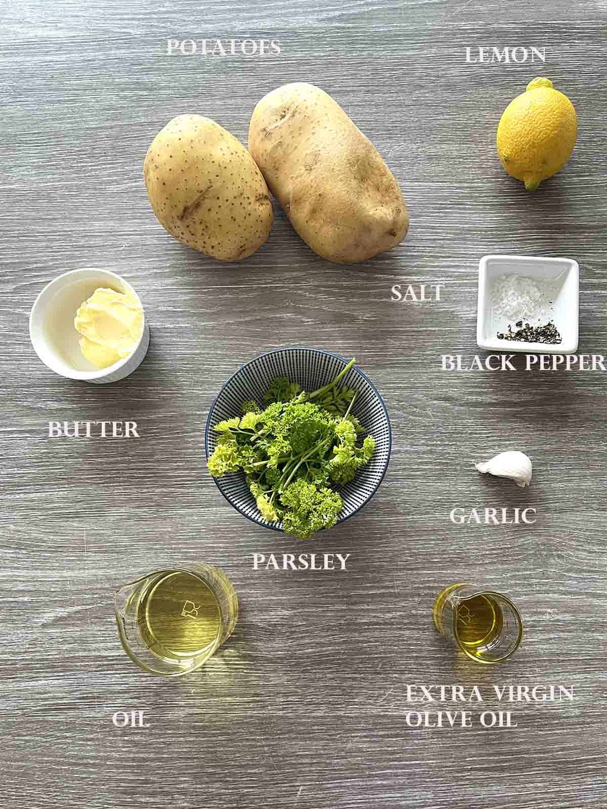 ingredients including potatoes and parsley on a board.