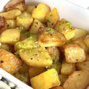 Pommes persillade or potatoes in a dish.