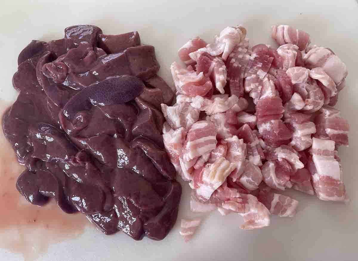 chopped bacon and liver on a board.