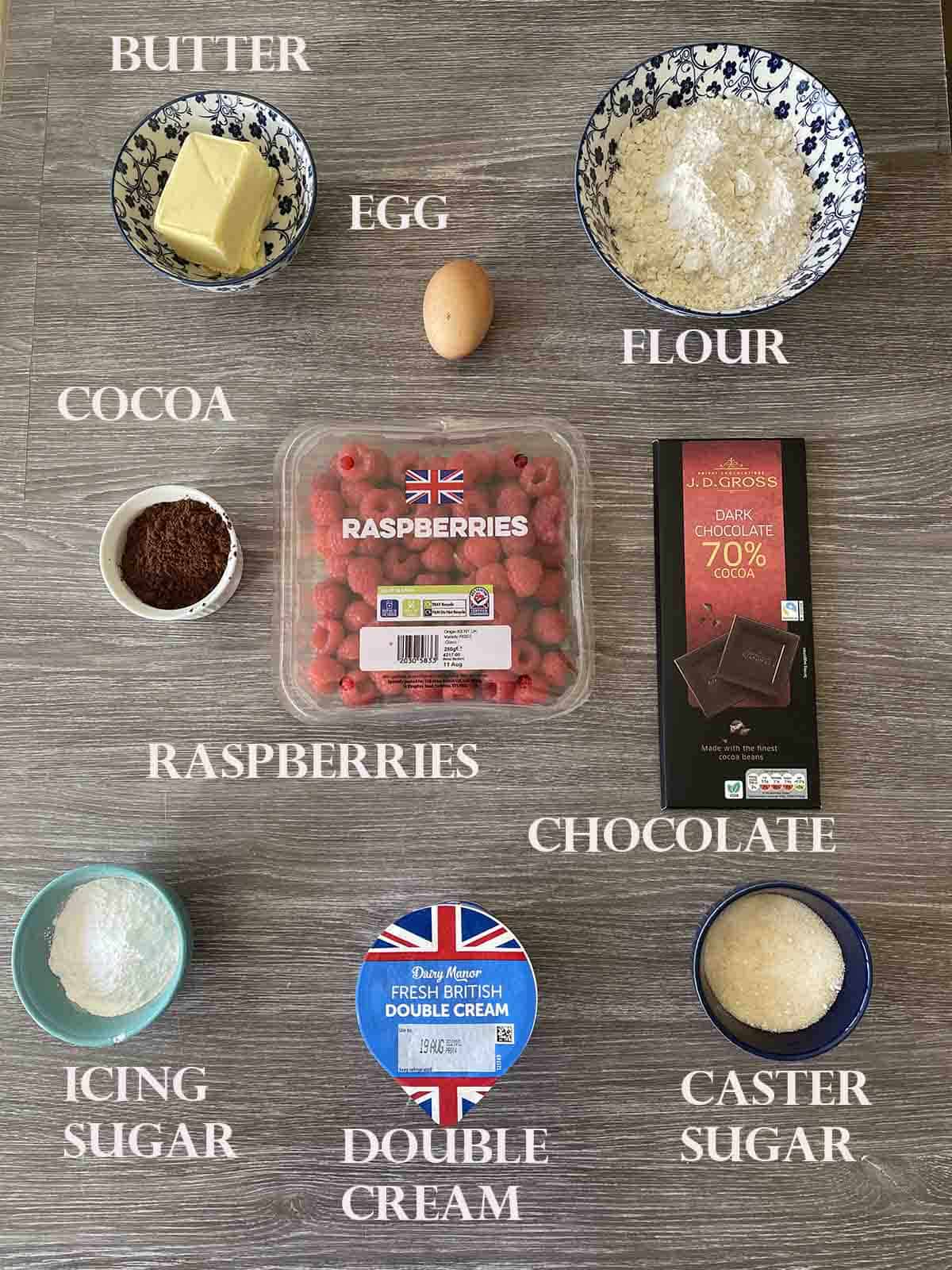 ingredients including chocolate, easpberries, flour, cream and butter.