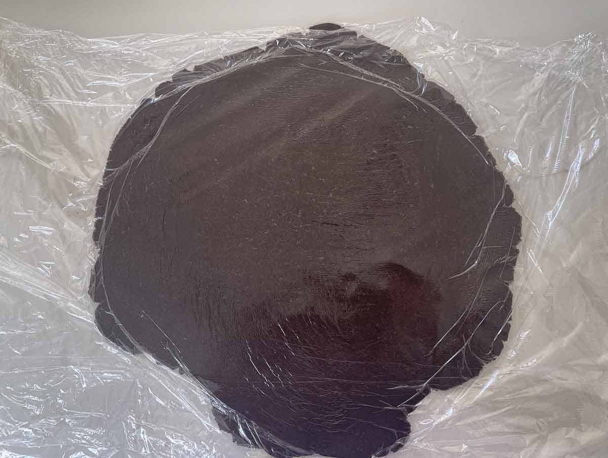 pastry rolled out in plastic wrap.