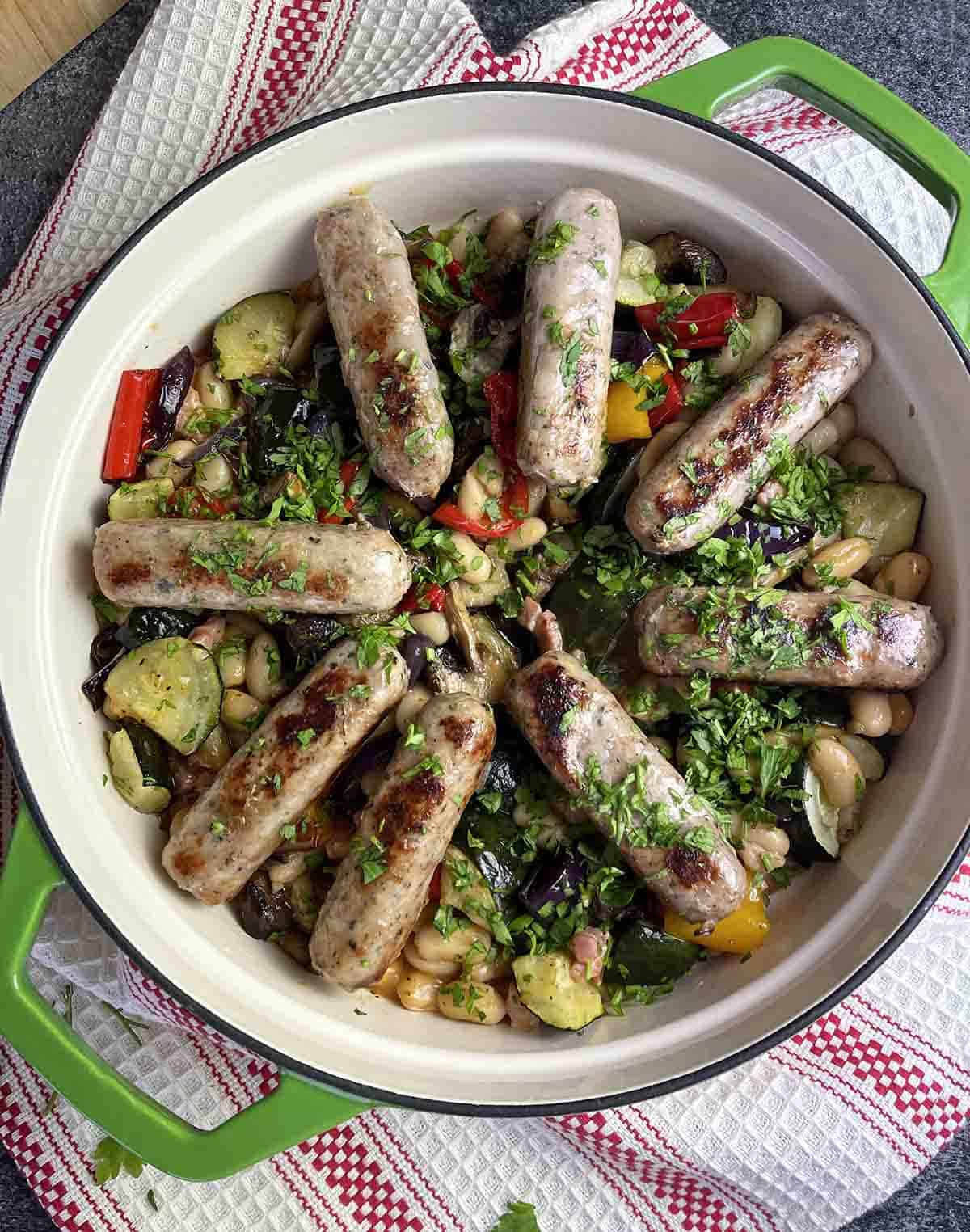 French bean and sausage stew in a dish.