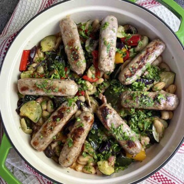 French bean and sausage stew in a dish.