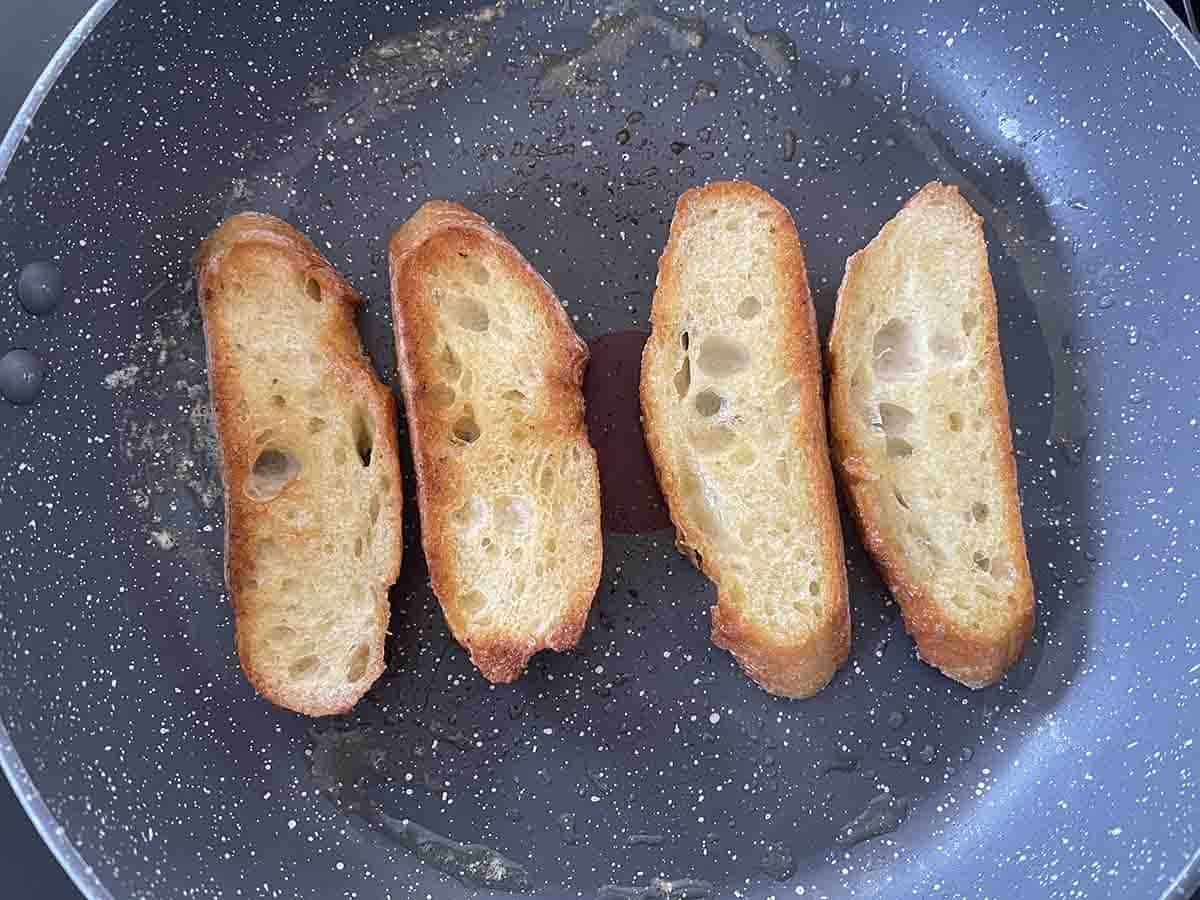 bread frying in a pan.