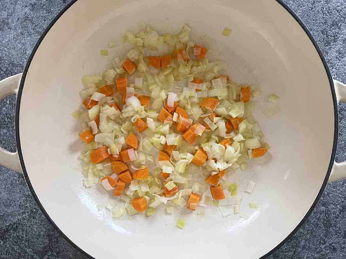 vegetables frying in a pan.