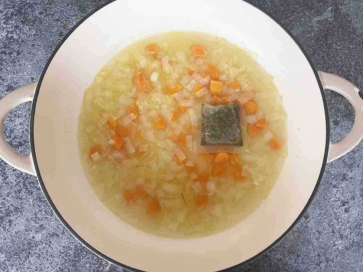 stock and wine added to pan.