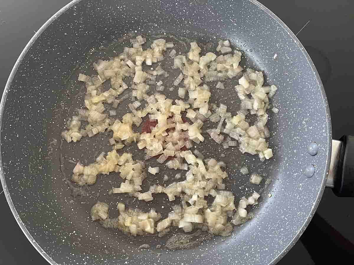shallots softening in a pan.