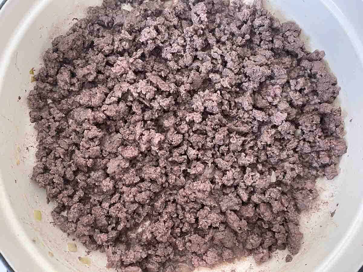 venison mince browning in a pan.