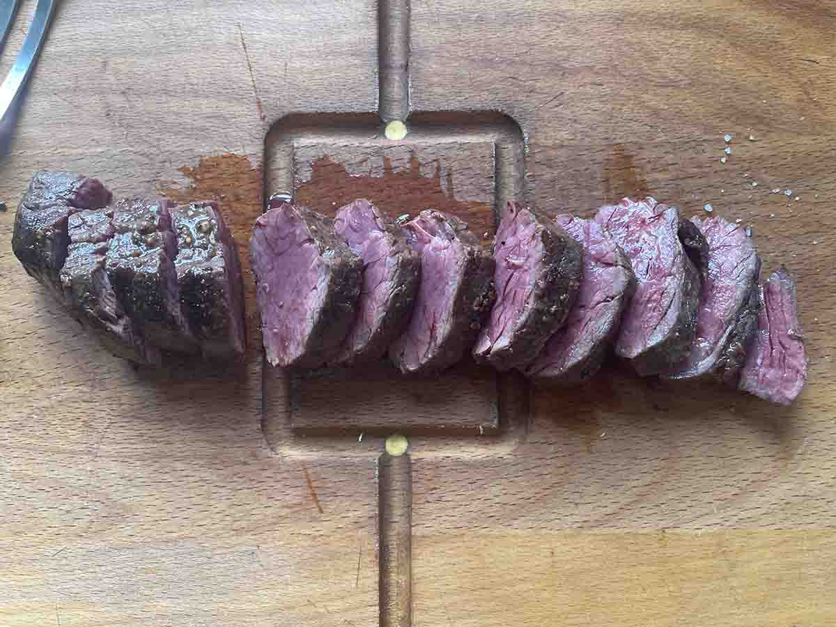sliced onglet on a board.