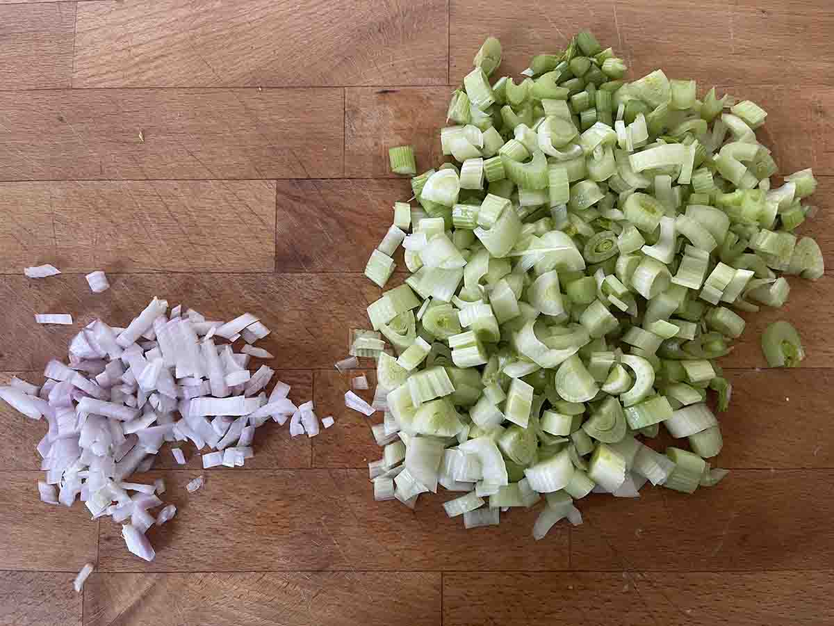 chopped fennel and shallot on a board.