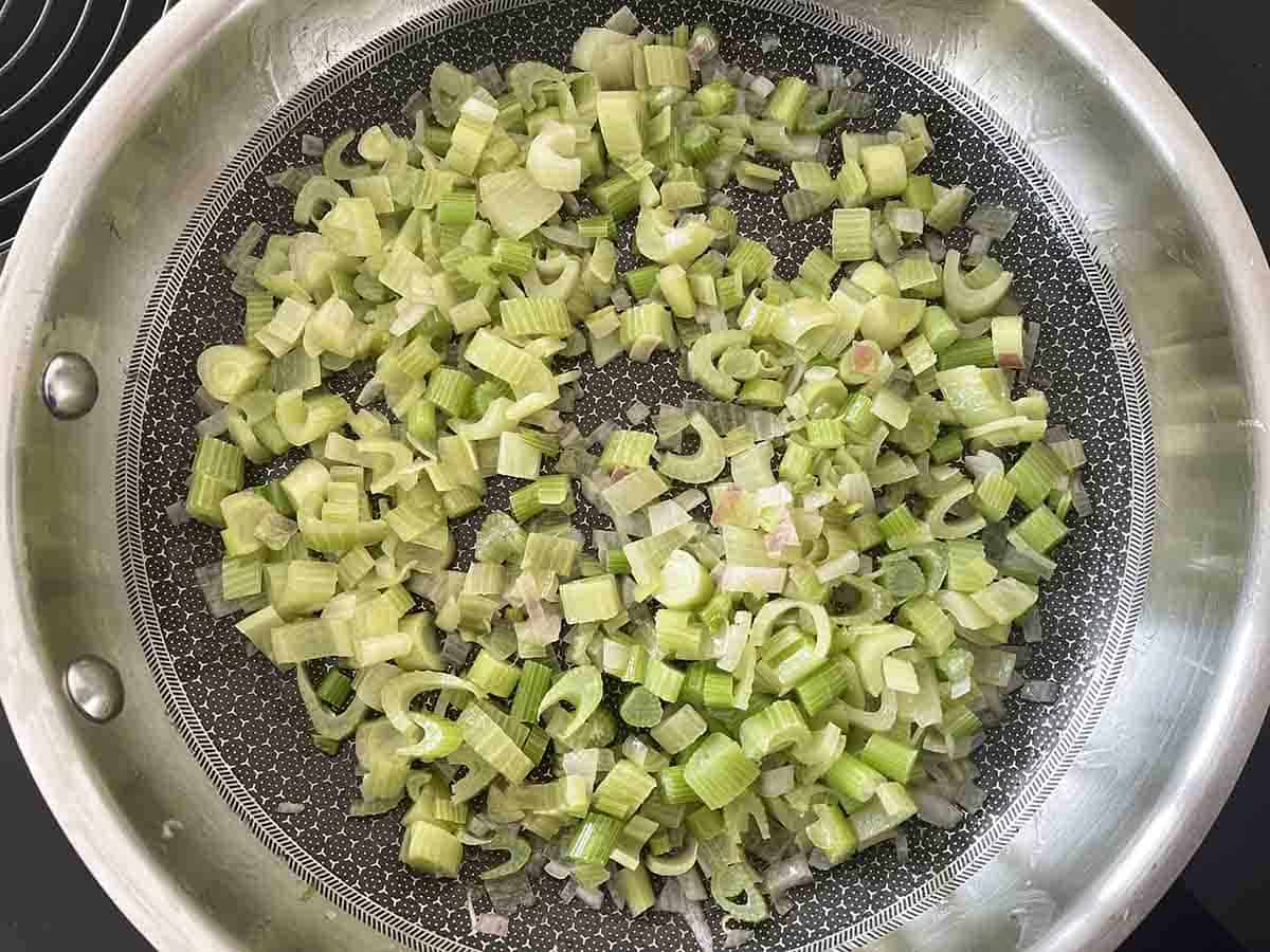 fennel and shallot softening in a pan.